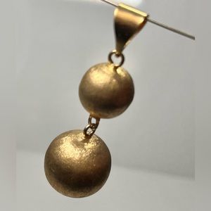 Brushed gold plated 2.25” dangle ball pendant marked “FH”